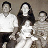 Barack at home with Lolo, mom and baby sister
